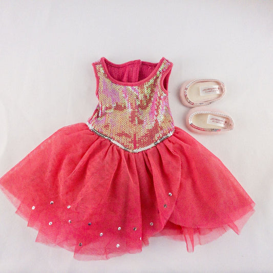 American Girl pink ballet dress with sequin bodice and tulle skirt with matching slippers laid flat on white background showing front and back details