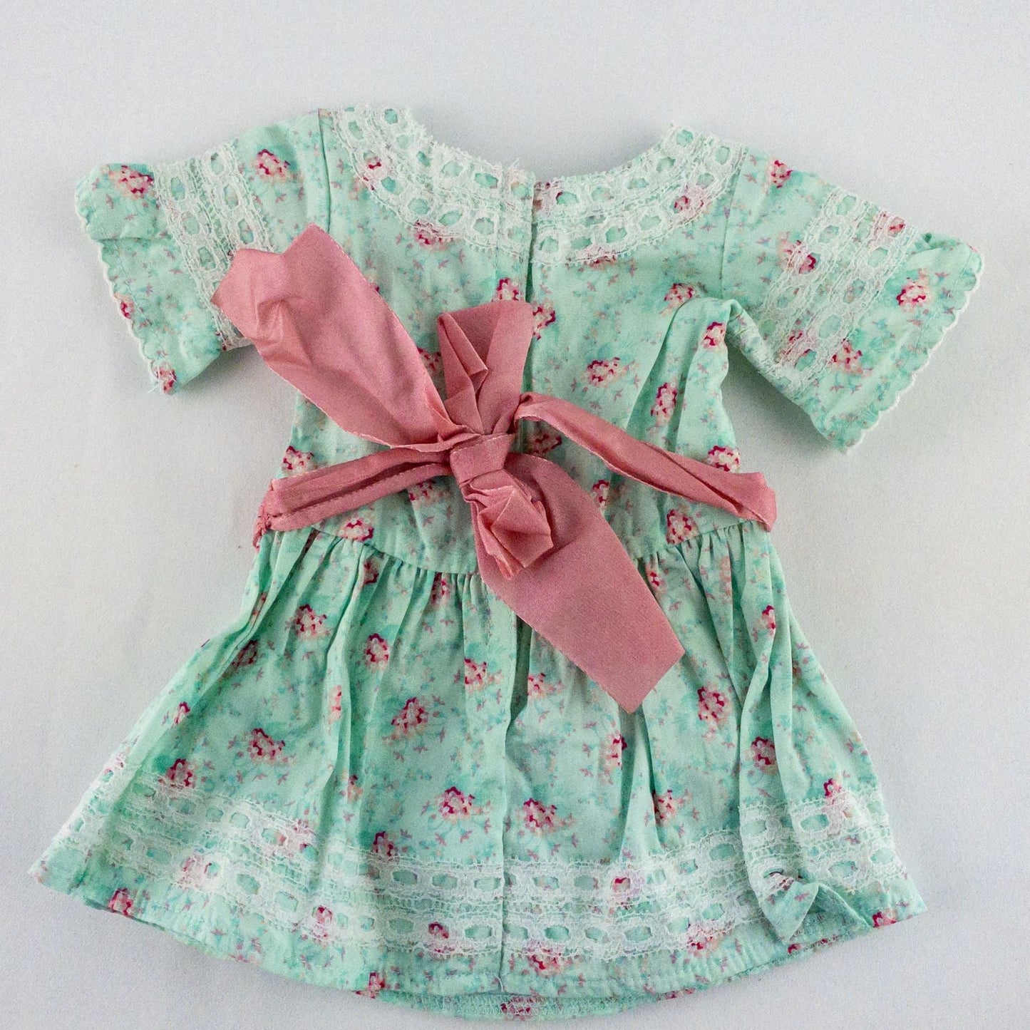 American Girl doll dress set including green floral doll dress with lace trim and pink bow sash, pink bow headband, white stockings, and red patent shoes image 4
