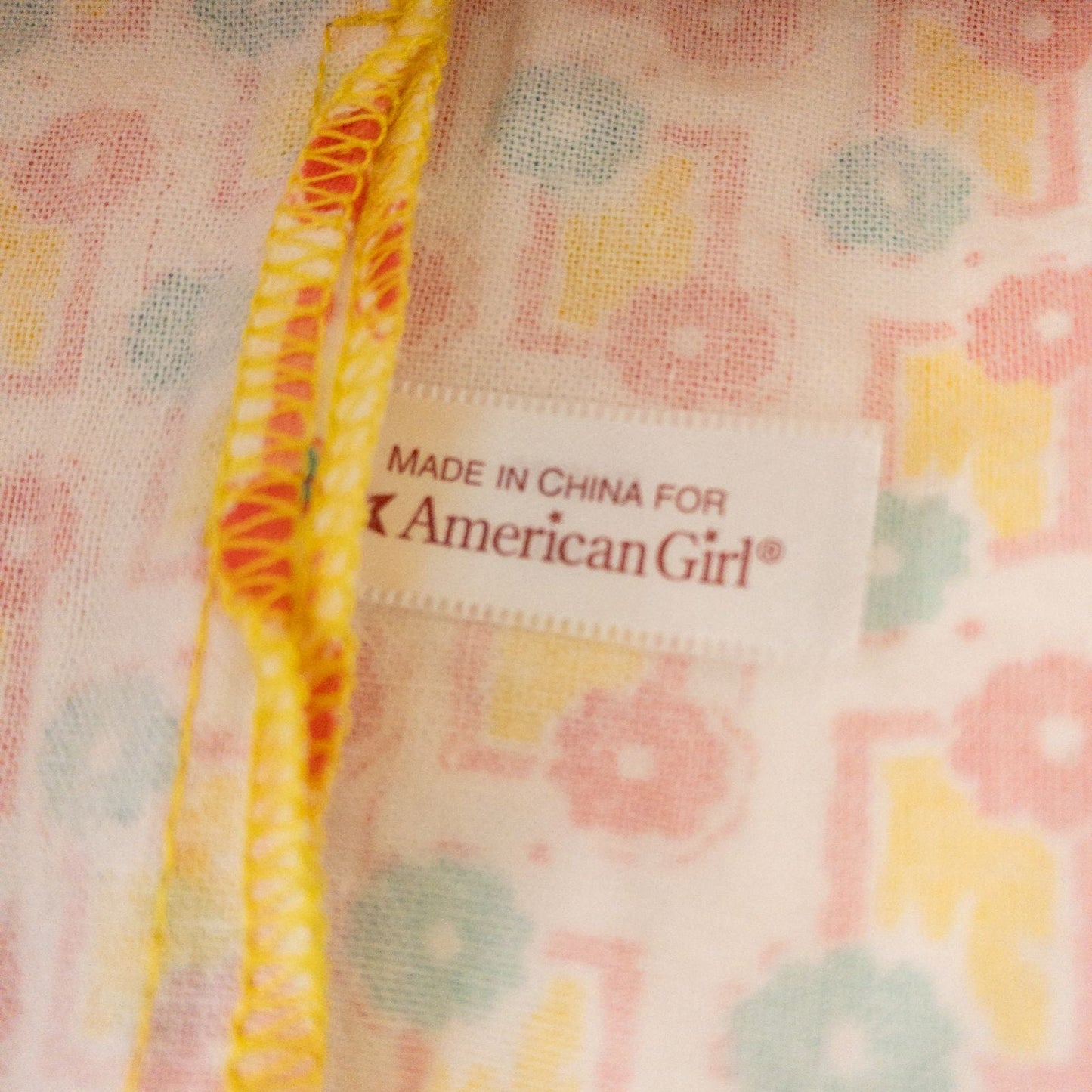 American Girl Kit doll outfit set with yellow floral dress, coral knit cardigan with flower buttons, and yellow shoes with coral bows image 5