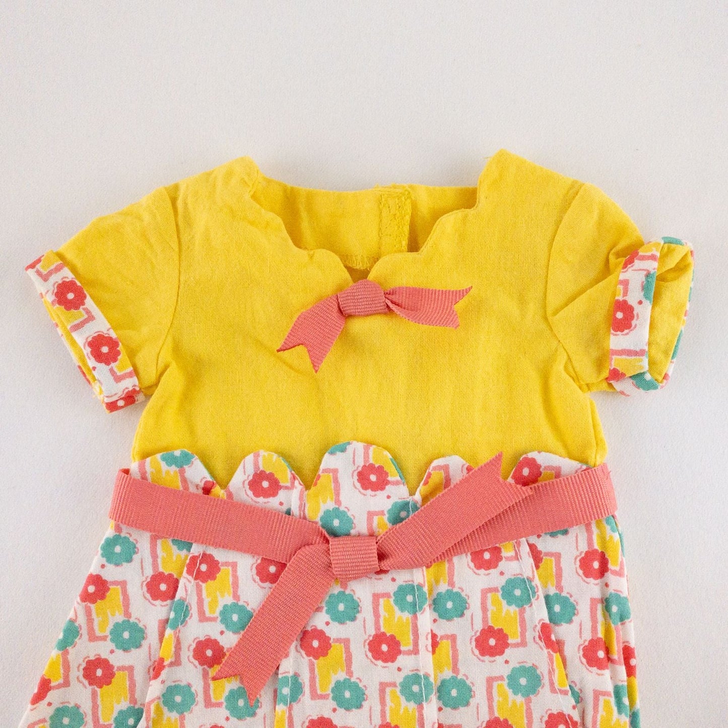 American Girl Kit doll outfit set with yellow floral dress, coral knit cardigan with flower buttons, and yellow shoes with coral bows image 3