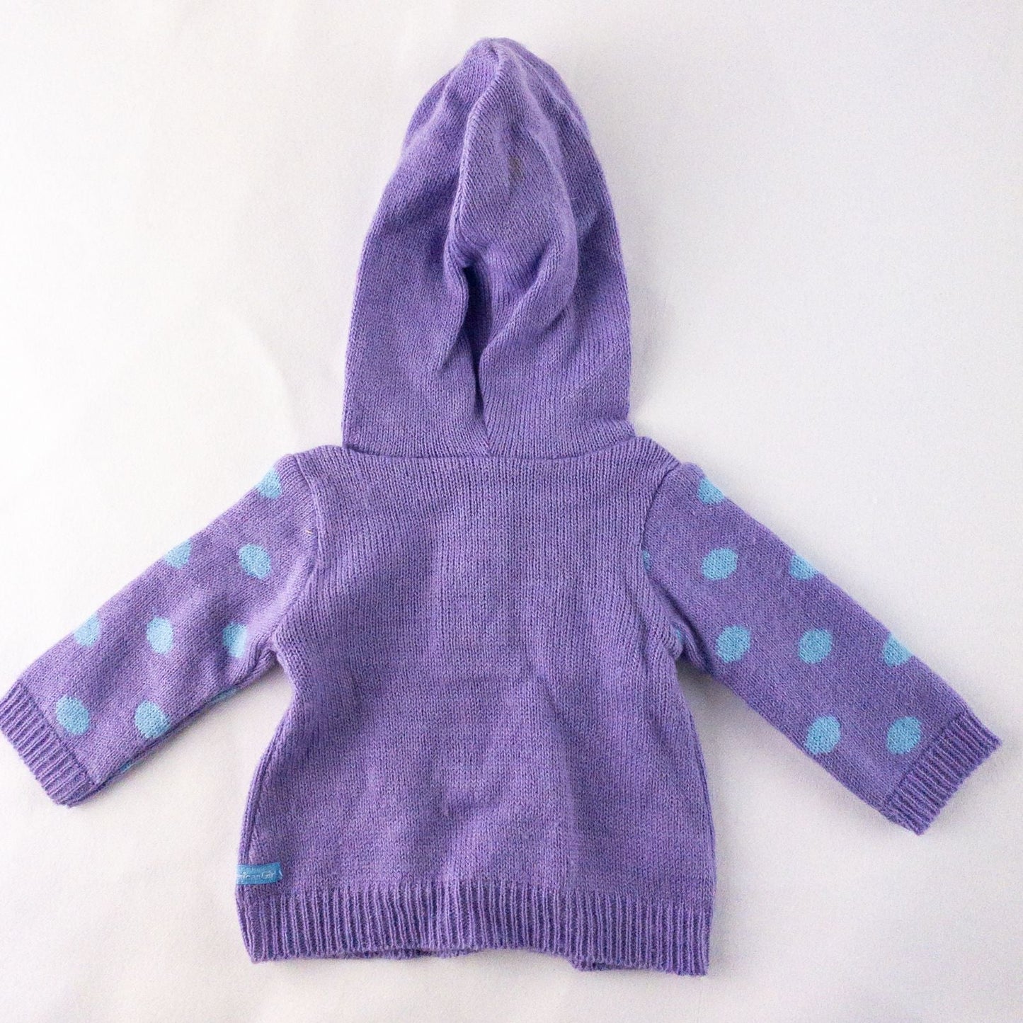 American Girl doll outfit with purple polka dot hoodie, blue pants, and magenta hat laid flat with visible light marks image 5