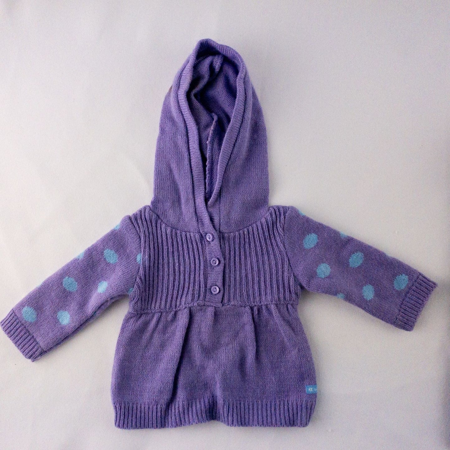 American Girl doll outfit with purple polka dot hoodie, blue pants, and magenta hat laid flat with visible light marks image 3