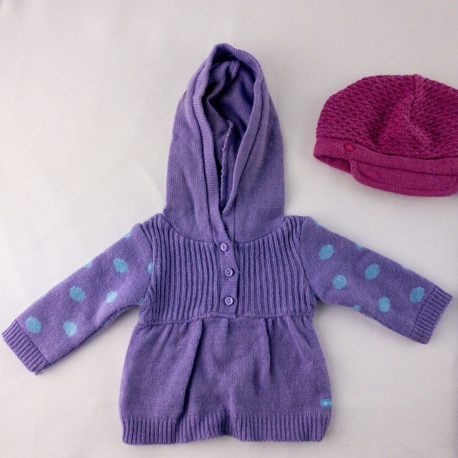 American Girl doll outfit with purple polka dot hoodie, blue pants, and magenta hat laid flat with visible light marks image 2
