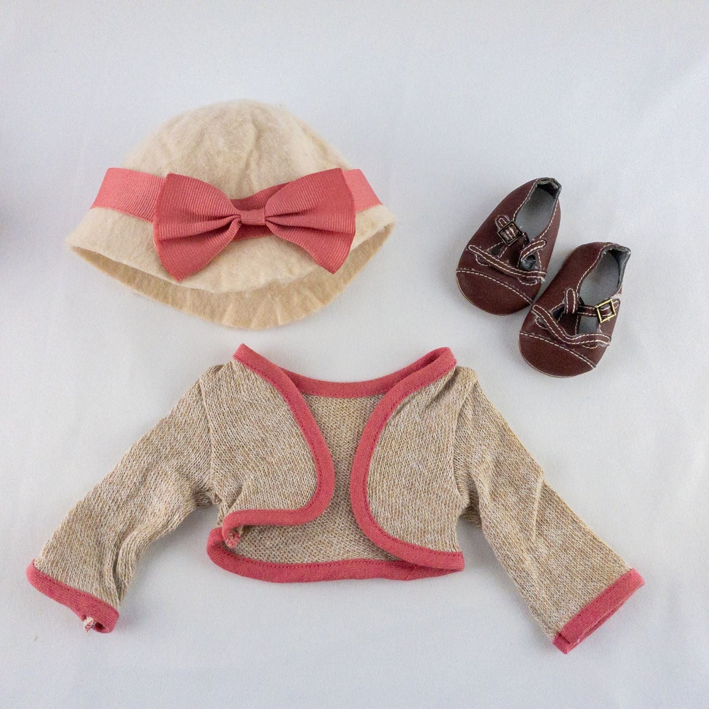 American Girl doll outfit set with floral top, pink skirt, cropped cardigan, hat, and tiny shoes laid flat image 7