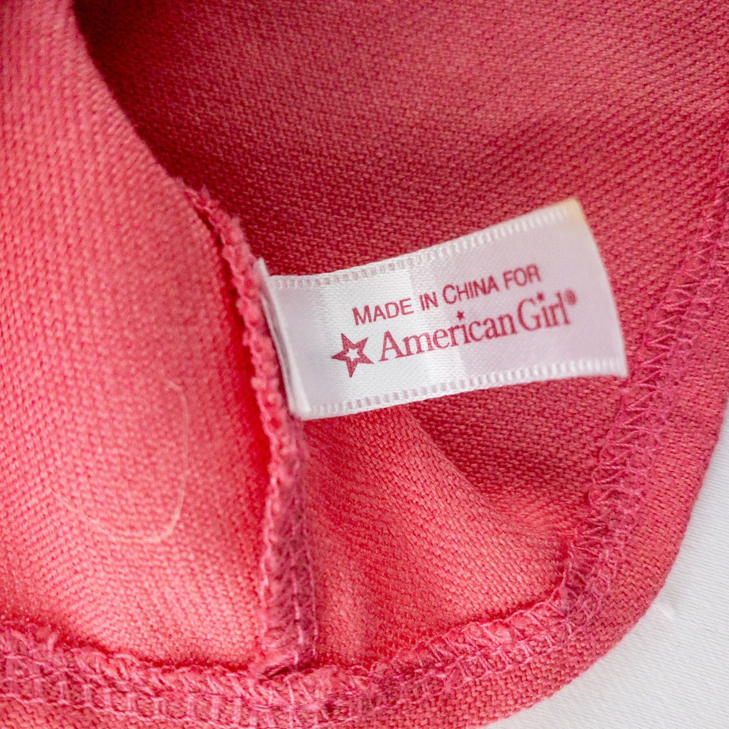 American Girl doll outfit set with floral top, pink skirt, cropped cardigan, hat, and tiny shoes laid flat image 4