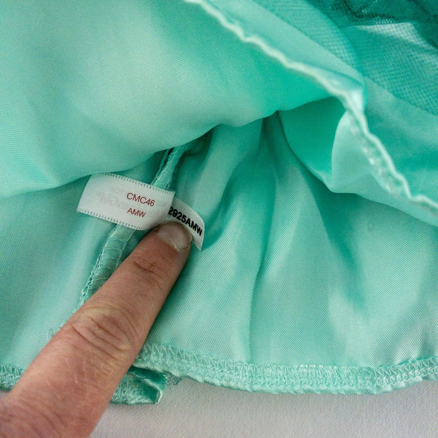 American Girl vintage green emerald doll dress with layered tulle skirt, pink flower belt detail, matching green headband, and red shoes with white bows image 9