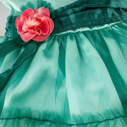 American Girl vintage green emerald doll dress with layered tulle skirt, pink flower belt detail, matching green headband, and red shoes with white bows image 4