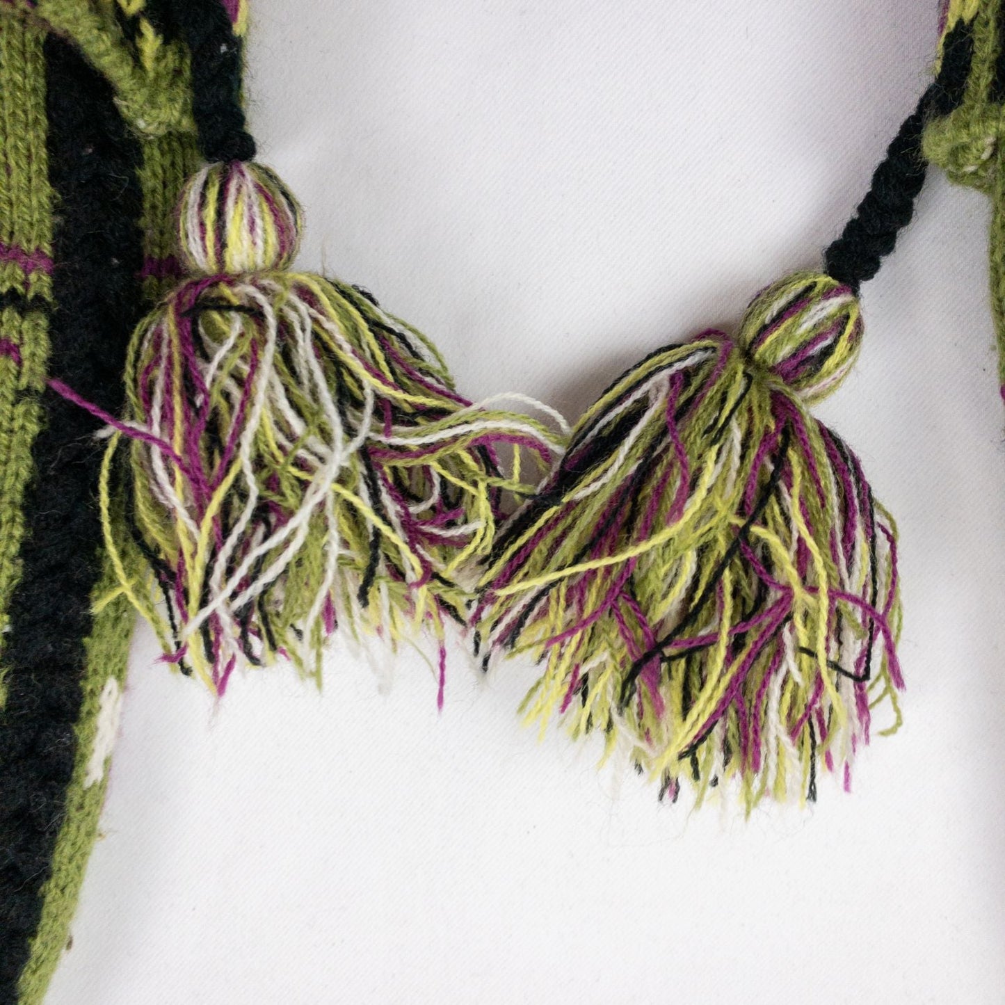 Green and purple fleece lined knit mittens with geometric pattern and tassels image 9