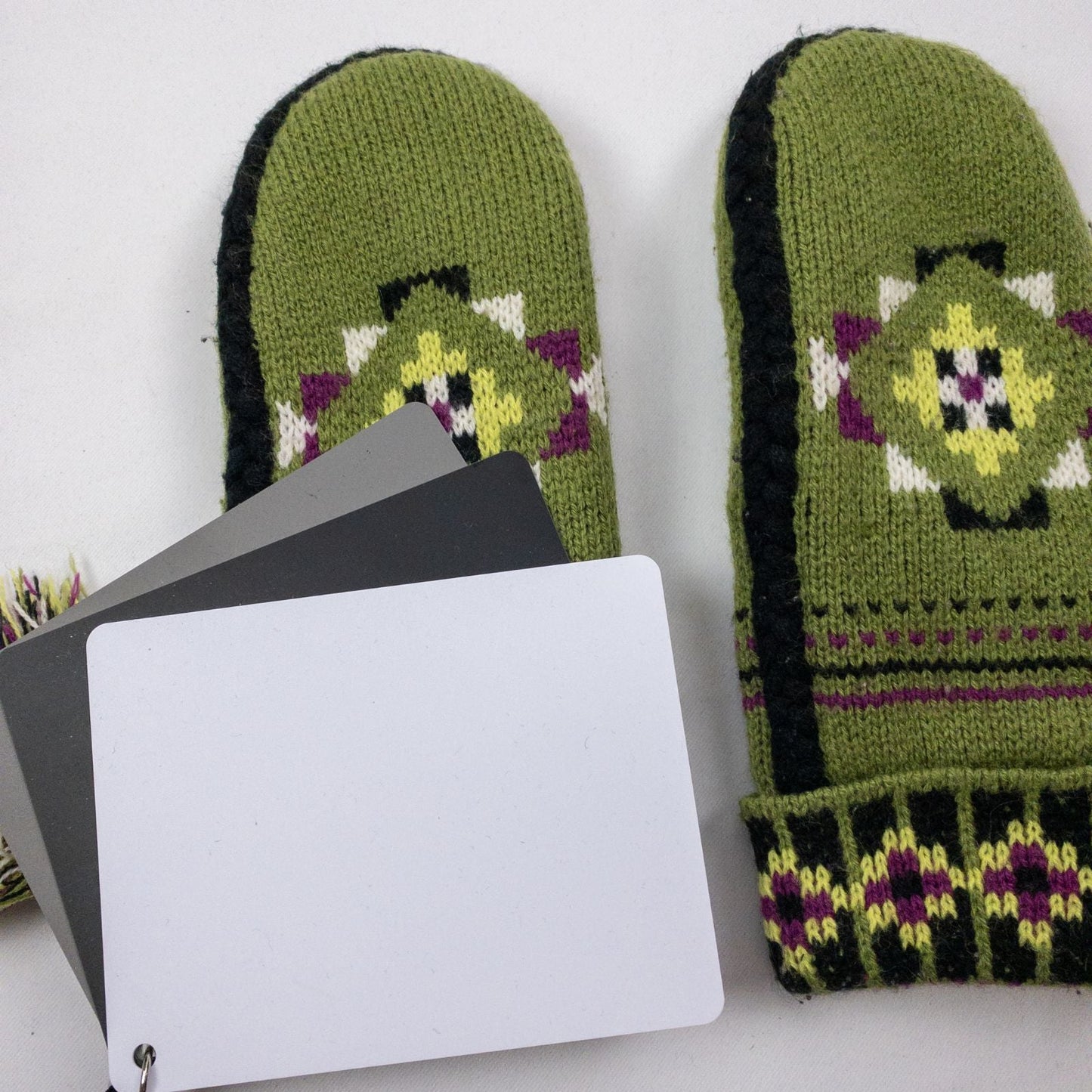 Green and purple fleece lined knit mittens with geometric pattern and tassels image 13
