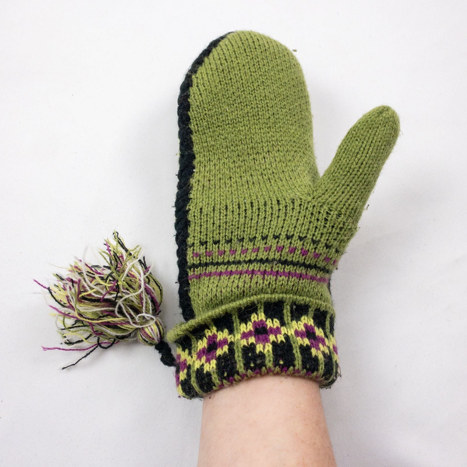 Green and purple fleece lined knit mittens with geometric pattern and tassels image 6