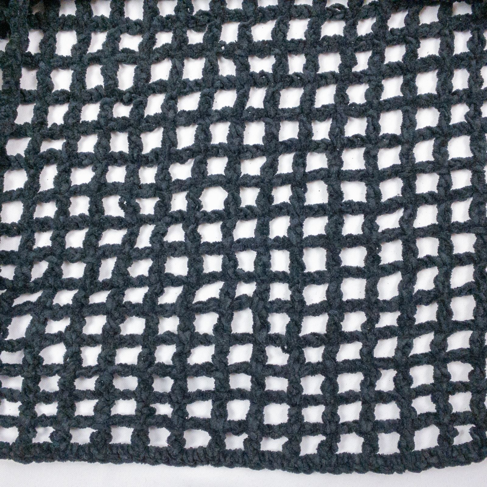 Carla Fernandez black fishnet knit rope sweater with short sleeves displayed on a hanger against a white background image 3