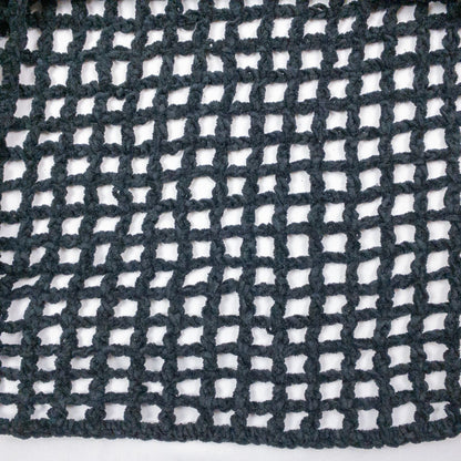 Carla Fernandez black fishnet knit rope sweater with short sleeves displayed on a hanger against a white background image 3