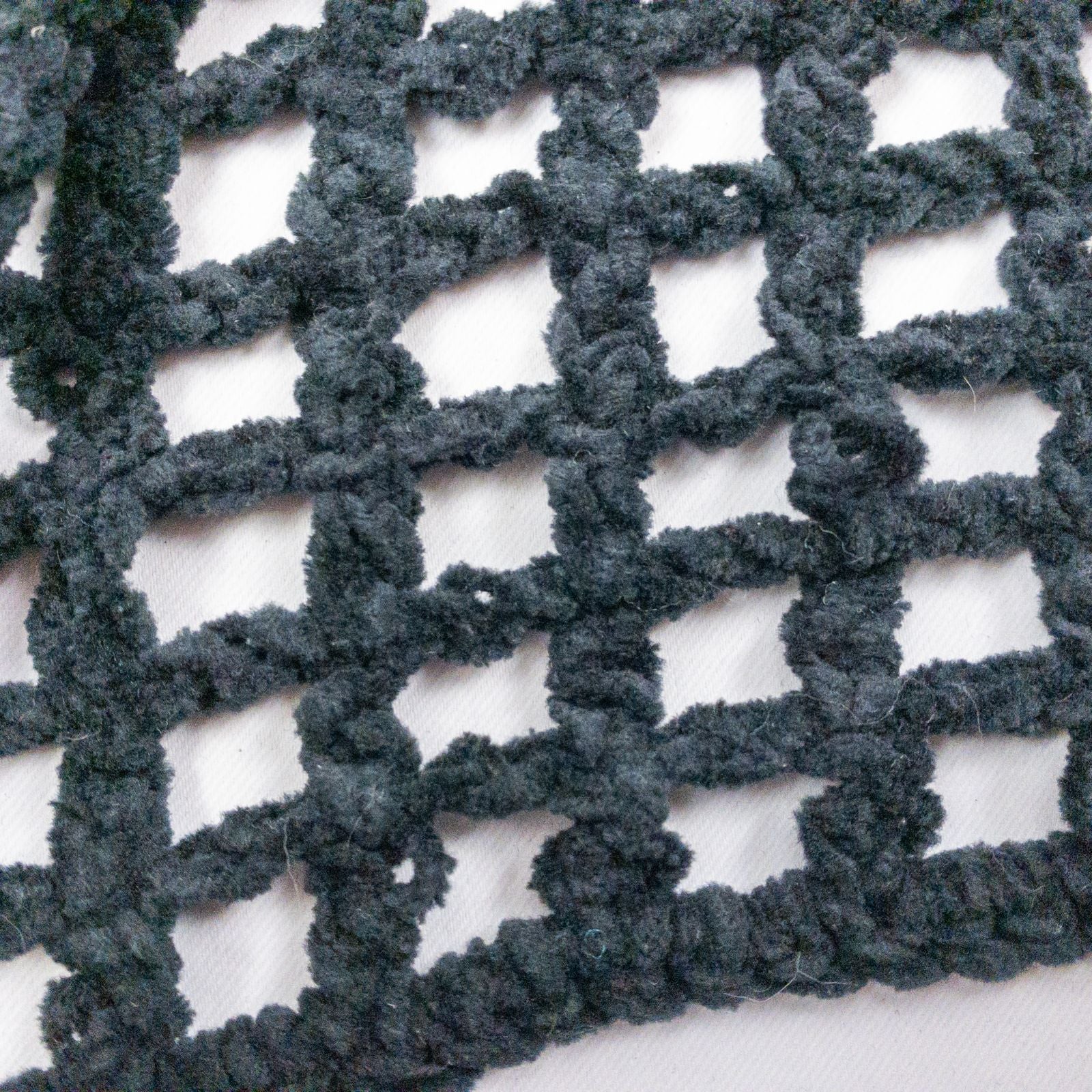 Carla Fernandez black fishnet knit rope sweater with short sleeves displayed on a hanger against a white background image 7