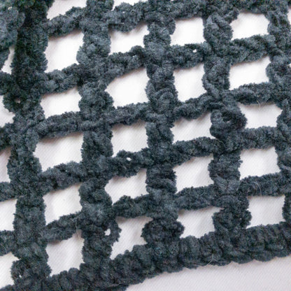 Carla Fernandez black fishnet knit rope sweater with short sleeves displayed on a hanger against a white background image 7