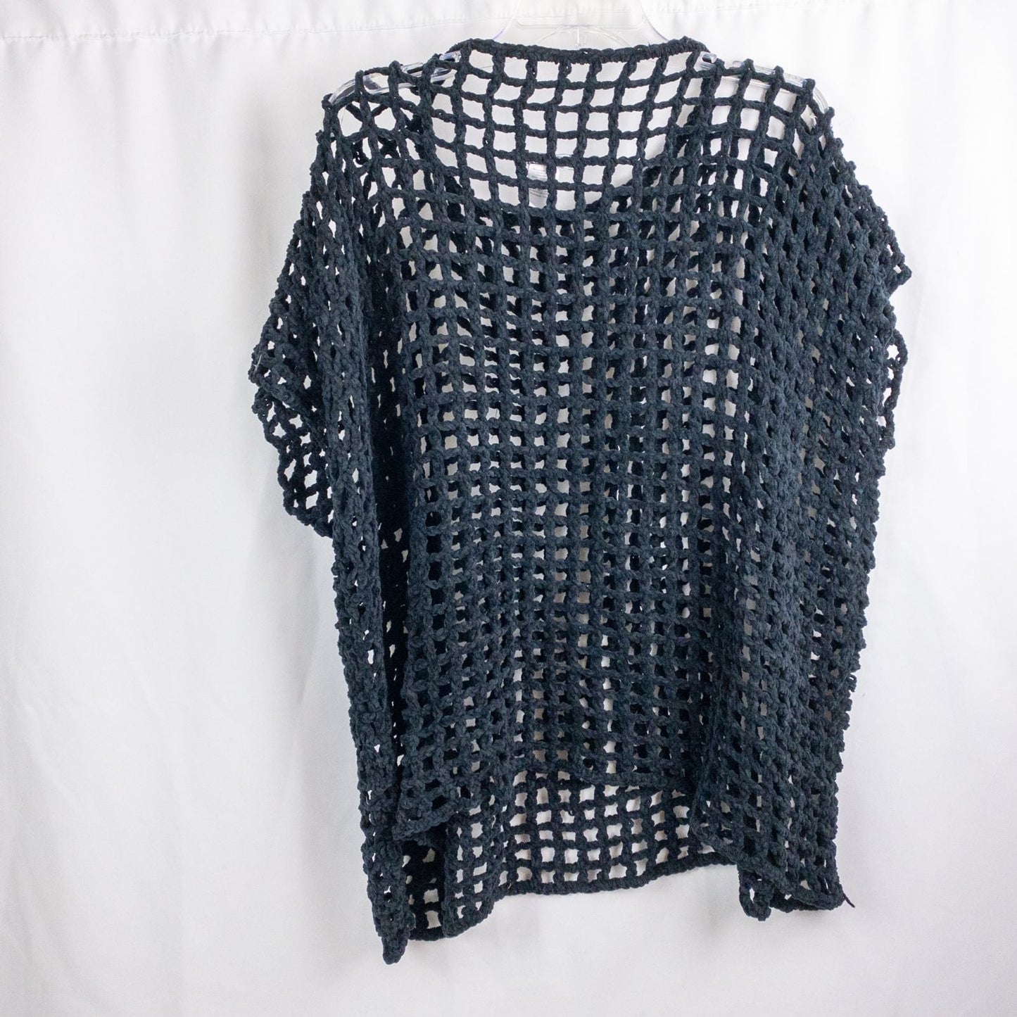 Carla Fernandez black fishnet knit rope sweater with short sleeves displayed on a hanger against a white background image 5