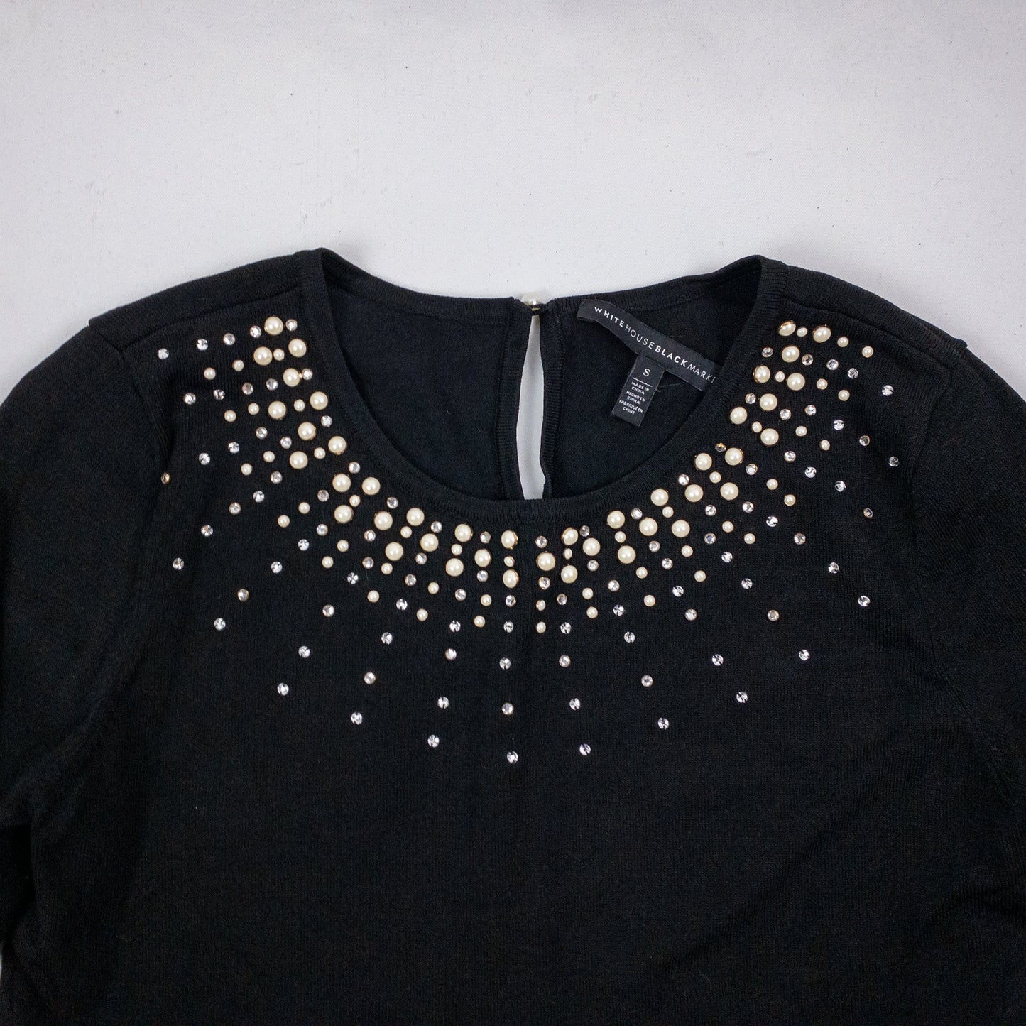 Black White House Black Market sweater with pearl and rhinestone neckline embellishments and 3/4 sleeves