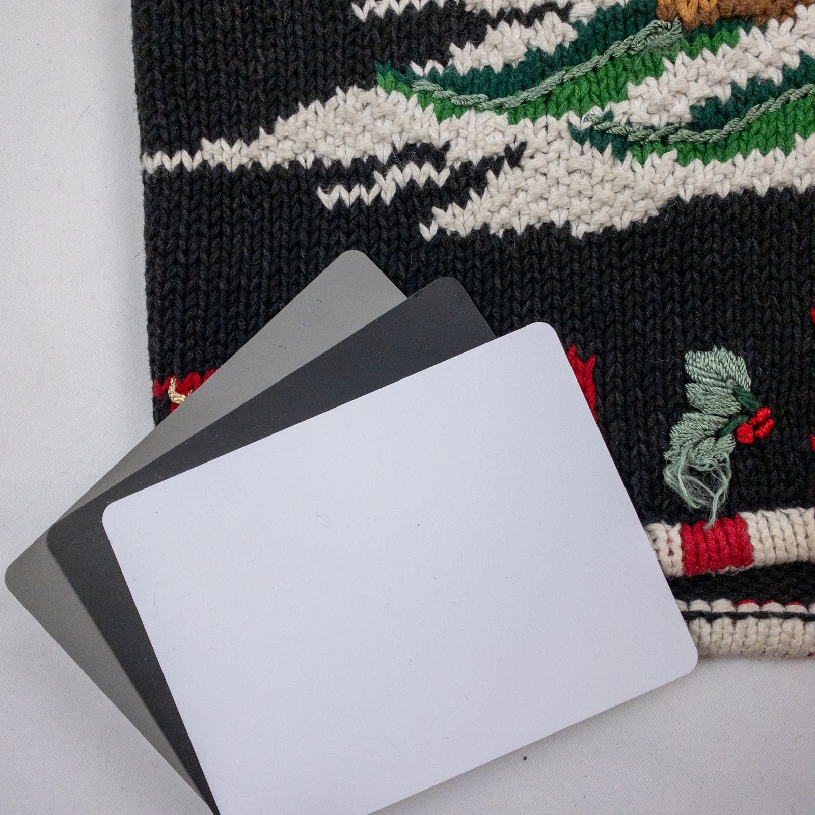 Tiara vintage black knitted sweater with embroidered Santa Claus and snowflakes, red and white striped trim image 10