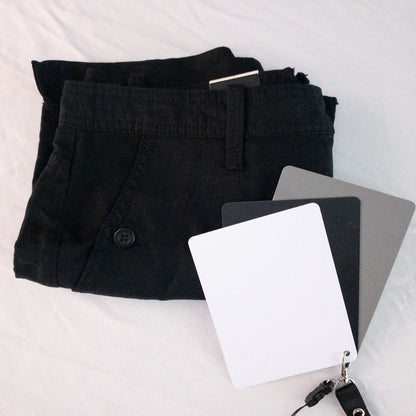 Calvin Klein black linen women's shorts size 4 with button details and front and back pockets displayed on white background image 7