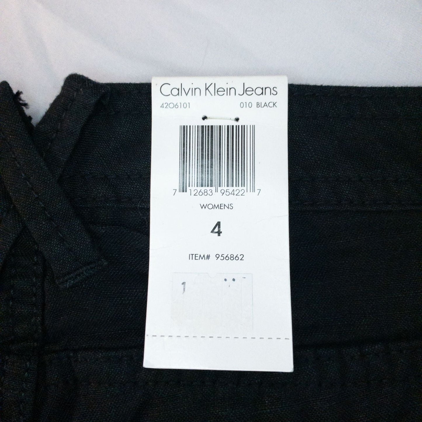 Calvin Klein black linen women's shorts size 4 with button details and front and back pockets displayed on white background image 11