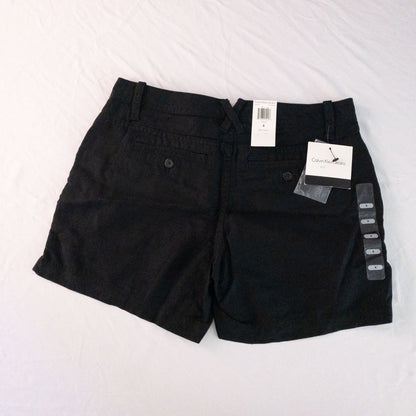 Calvin Klein black linen women's shorts size 4 with button details and front and back pockets displayed on white background image 5