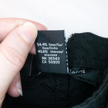 Calvin Klein black linen women's shorts size 4 with button details and front and back pockets displayed on white background image 9