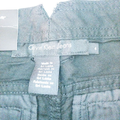 Calvin Klein black linen women's shorts size 4 with button details and front and back pockets displayed on white background image 8