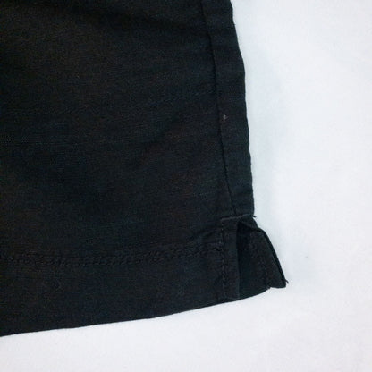 Calvin Klein black linen women's shorts size 4 with button details and front and back pockets displayed on white background image 4