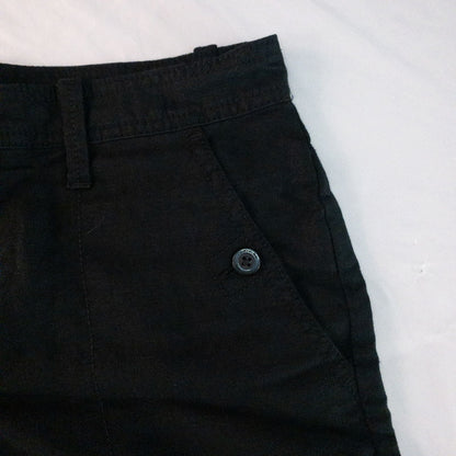 Calvin Klein black linen women's shorts size 4 with button details and front and back pockets displayed on white background image 3