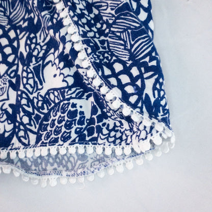 Lily Pullitzer blue fish print lounge shorts with pom pom trim and drawstring waistband laid flat image 6