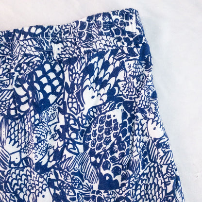 Lily Pullitzer blue fish print lounge shorts with pom pom trim and drawstring waistband laid flat image 9
