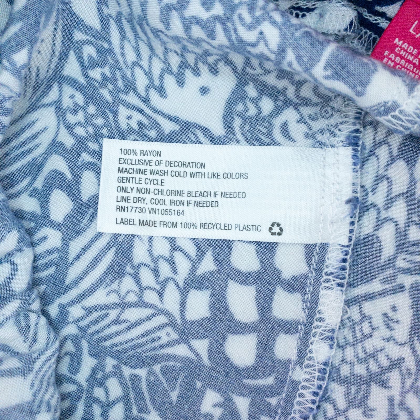 Lily Pullitzer blue fish print lounge shorts with pom pom trim and drawstring waistband laid flat image 12