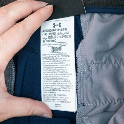 Under Armour navy men's shorts laid flat showing front and back views with button and logo details image 11