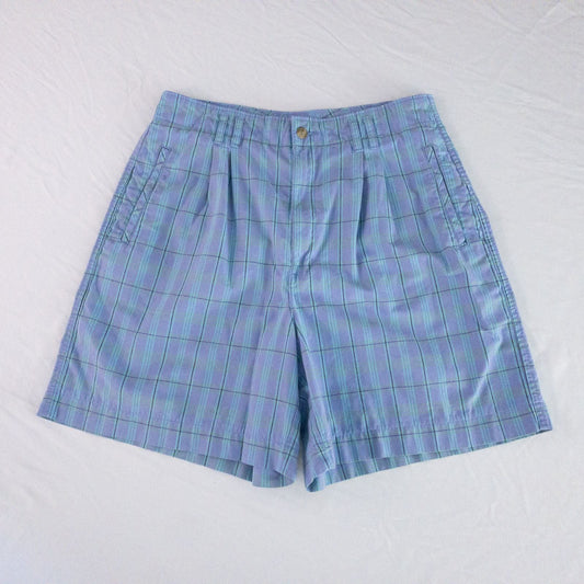 Levis Dockers purple plaid women's shorts laid flat showing front, side pockets, waistband details, and small wear dot
