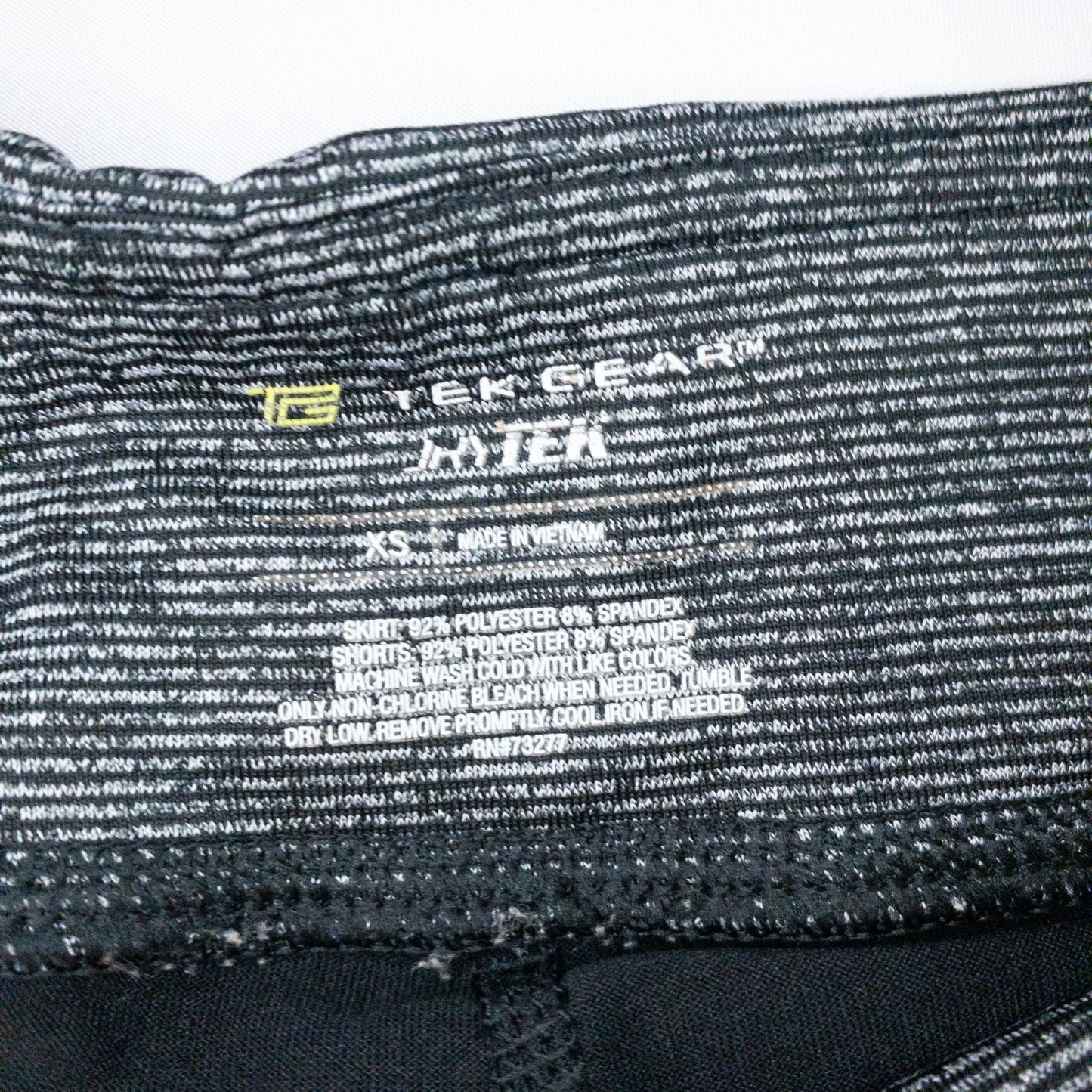 Tekgear black gray striped skorts womens XSmall with elastic waistband and inner shorts, detailed close-ups of fabric and logo image 6