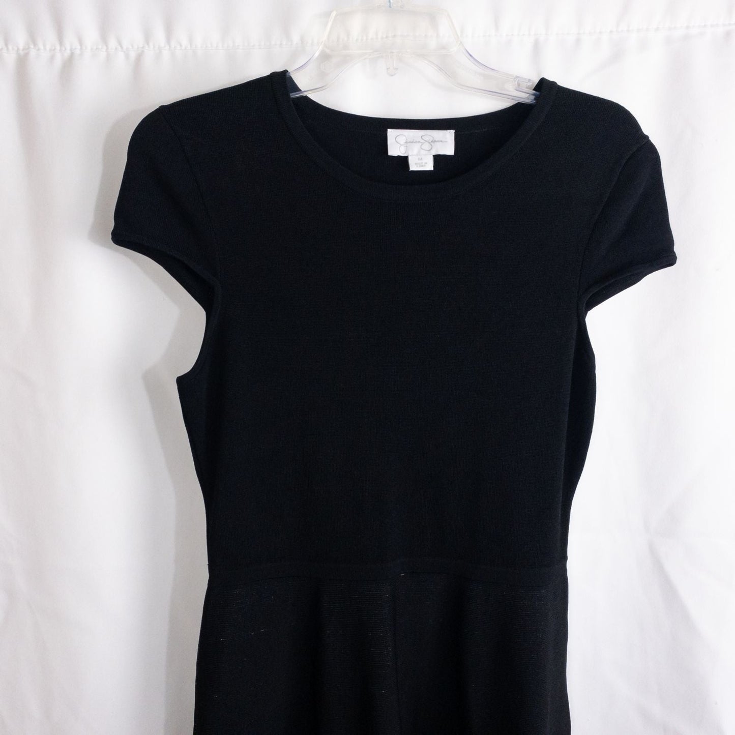 Jessica Simpson black knit fit and flare dress with short sleeves and flared skirt image 2