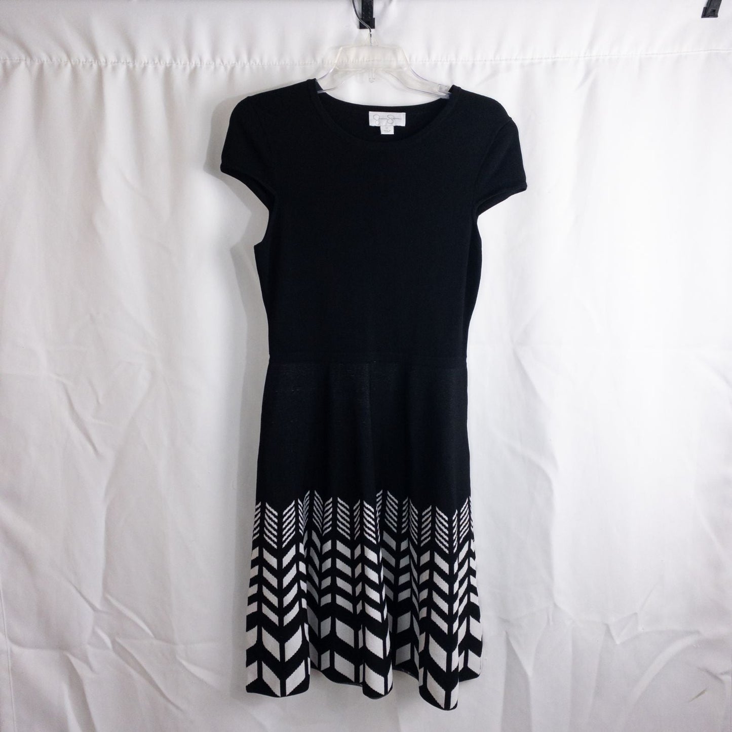 Jessica Simpson black knit fit and flare dress with short sleeves and flared skirt