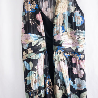 Adrianna Papell black floral maxi dress with twisted front detail hanging on clear hanger in front of white background image 9