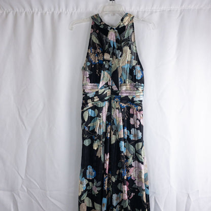 Adrianna Papell black floral maxi dress with twisted front detail hanging on clear hanger in front of white background image 6