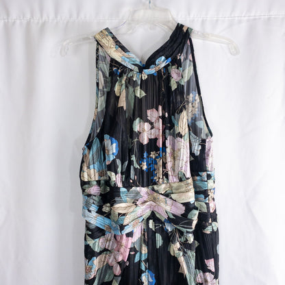 Adrianna Papell black floral maxi dress with twisted front detail hanging on clear hanger in front of white background image 2