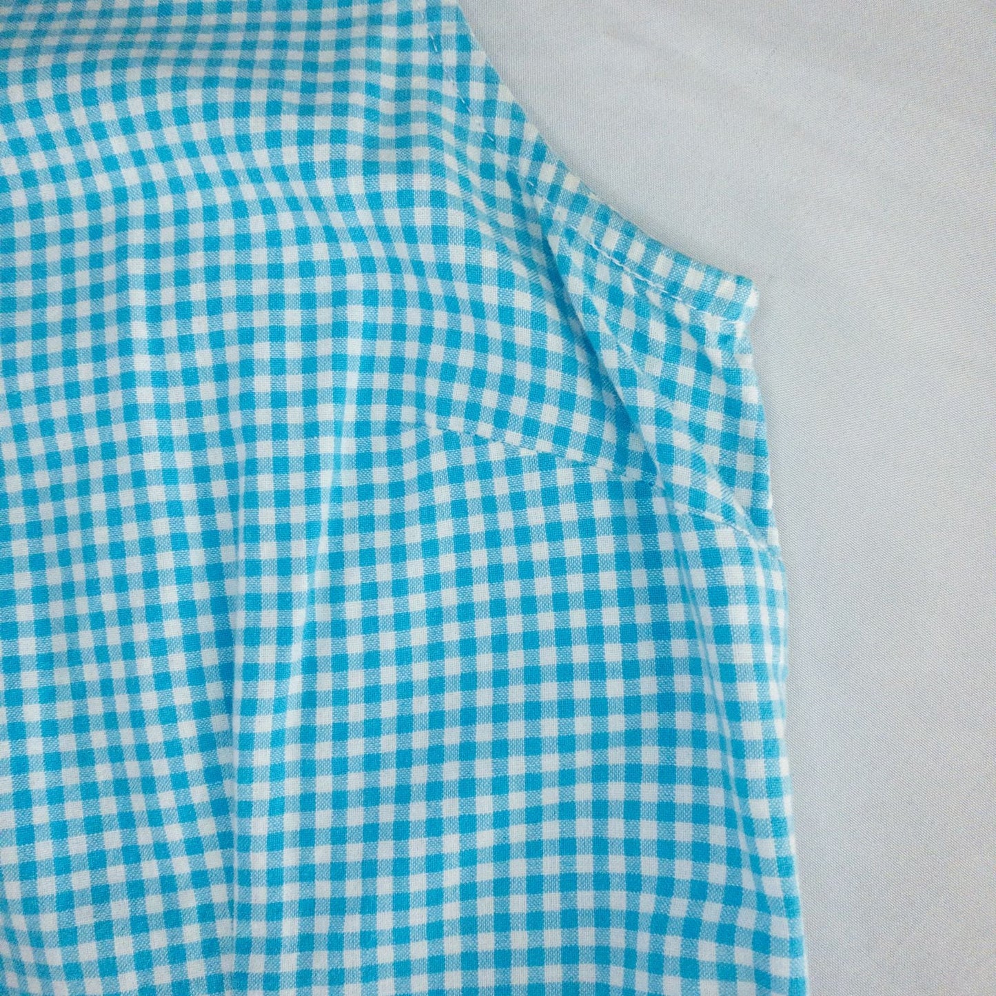 Faded Glory vintage blue and white gingham sleeveless dress with v-neck and back zipper on clear hanger against white background image 3
