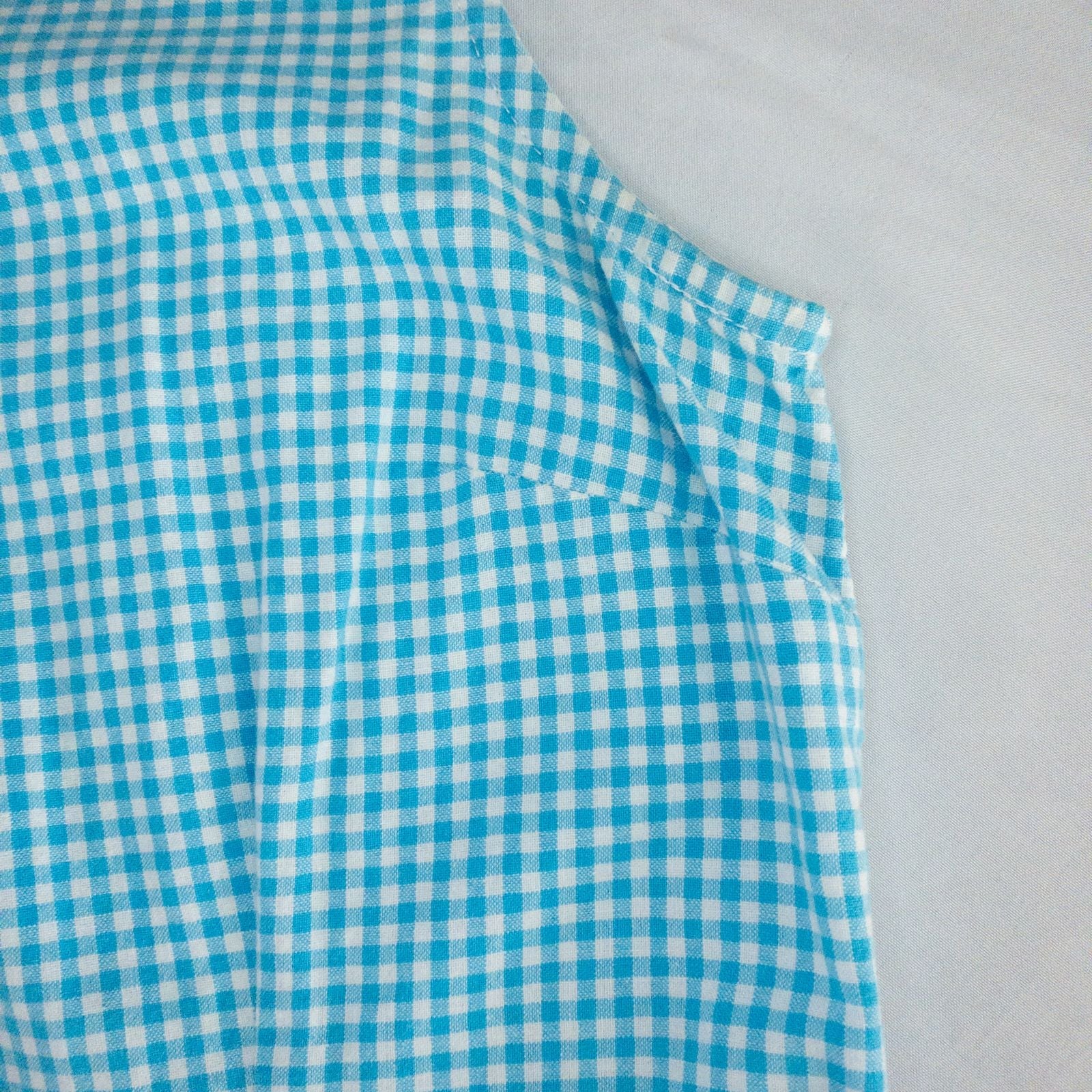 Faded Glory vintage blue and white gingham sleeveless dress with v-neck and back zipper on clear hanger against white background image 3