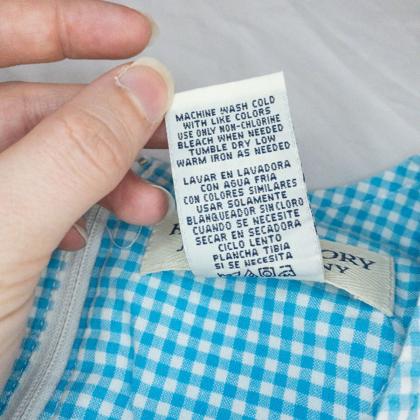 Faded Glory vintage blue and white gingham sleeveless dress with v-neck and back zipper on clear hanger against white background image 11