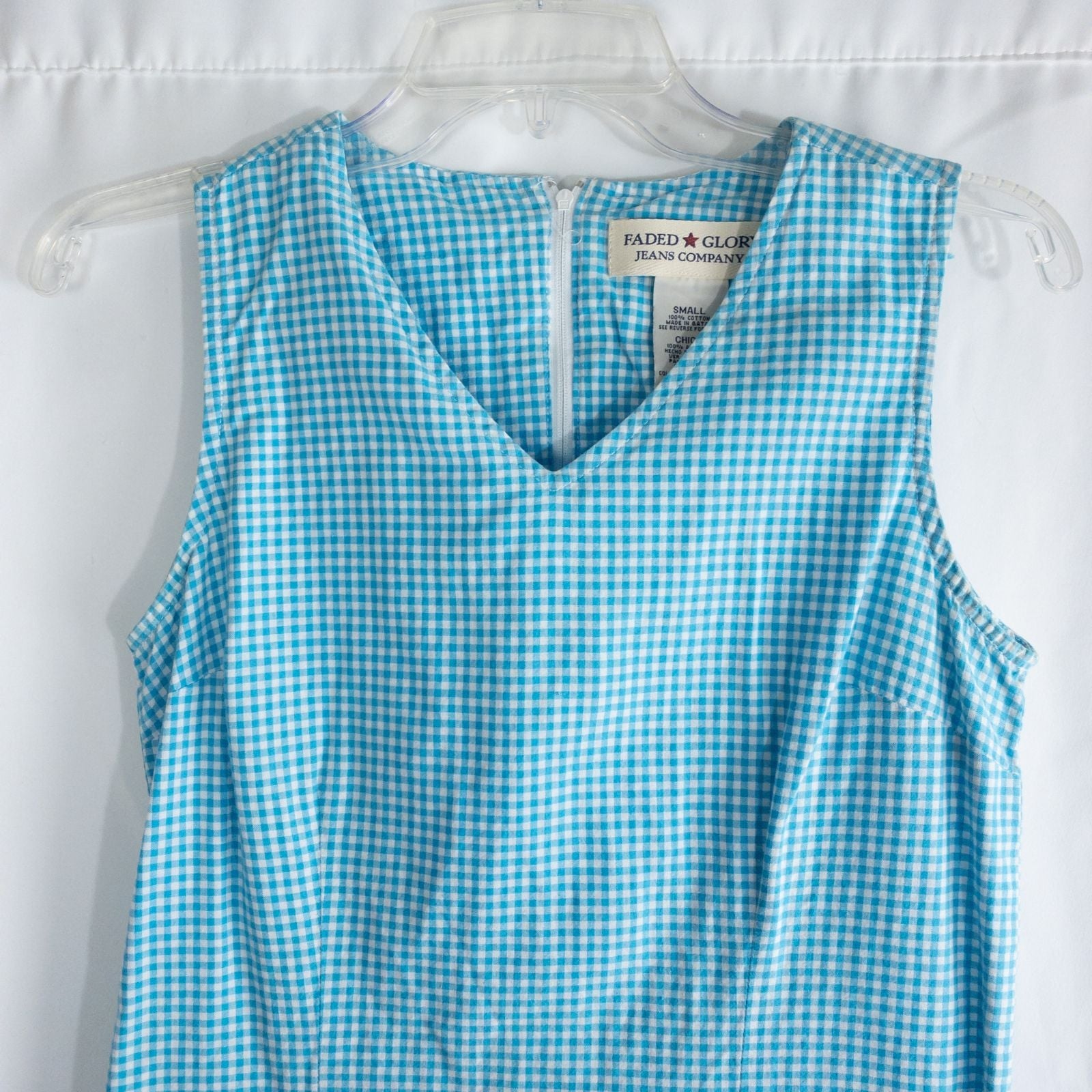 Faded Glory vintage blue and white gingham sleeveless dress with v-neck and back zipper on clear hanger against white background image 2