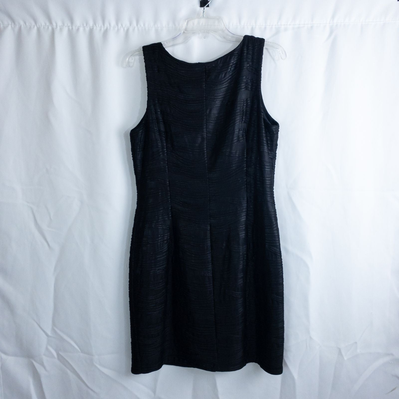 Joseph Ribkoff black pleated sleeveless minidress hanging on hanger with textured fabric image 6