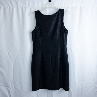 Joseph Ribkoff black pleated sleeveless minidress hanging on hanger with textured fabric image 6