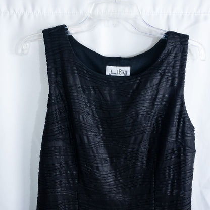 Joseph Ribkoff black pleated sleeveless minidress hanging on hanger with textured fabric image 2