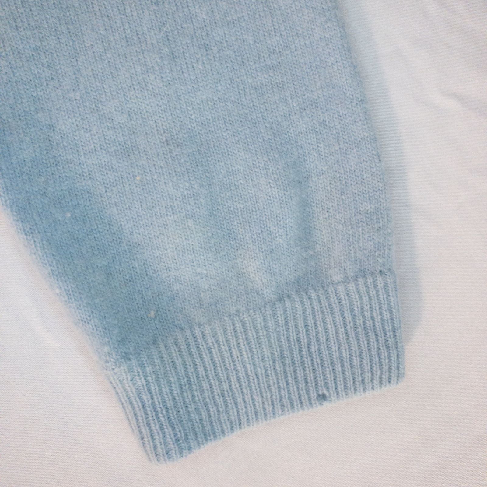 Stewarts pastel blue vintage cardigan with white bead floral embellishments and pearl buttons on a hanger image 14