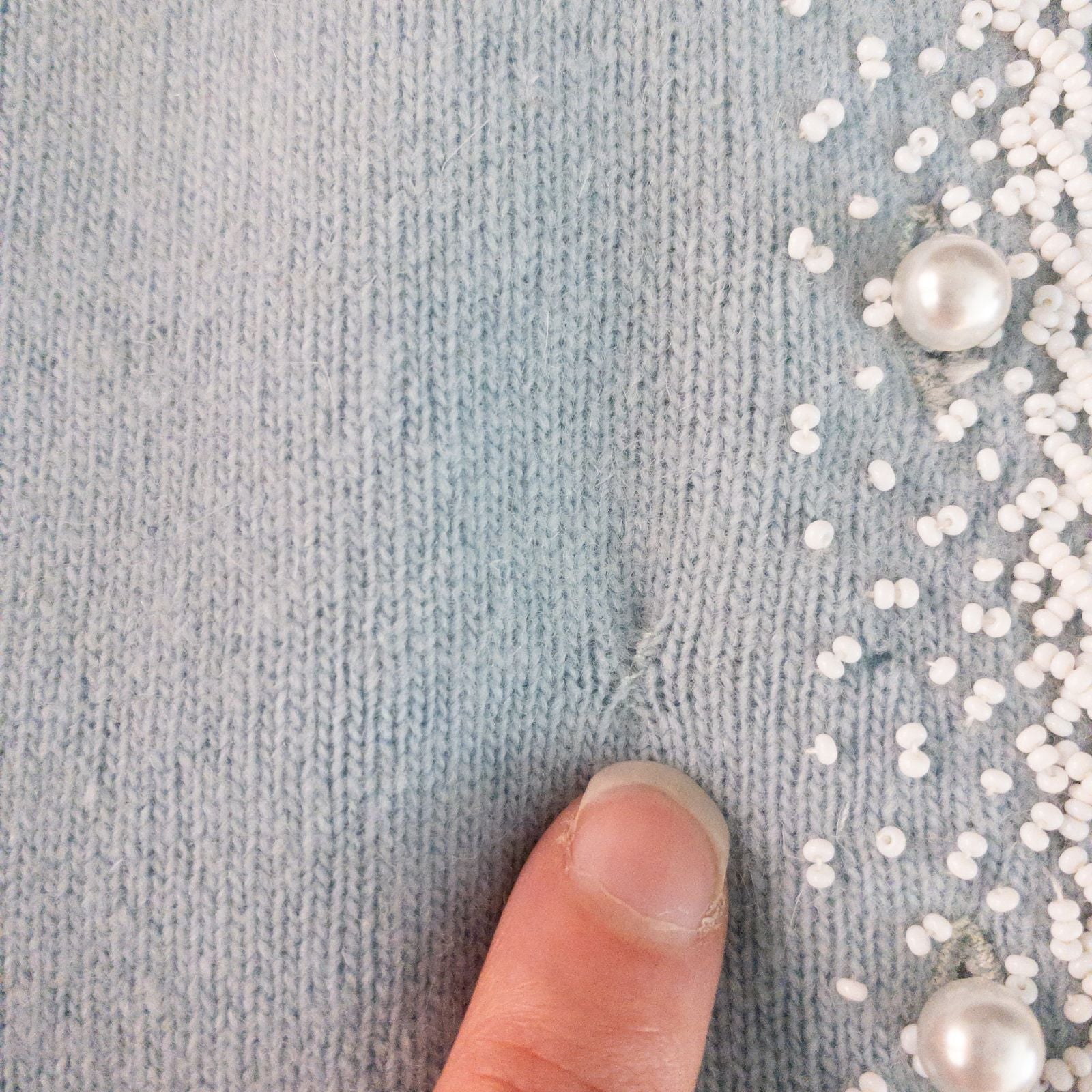 Stewarts pastel blue vintage cardigan with white bead floral embellishments and pearl buttons on a hanger image 5