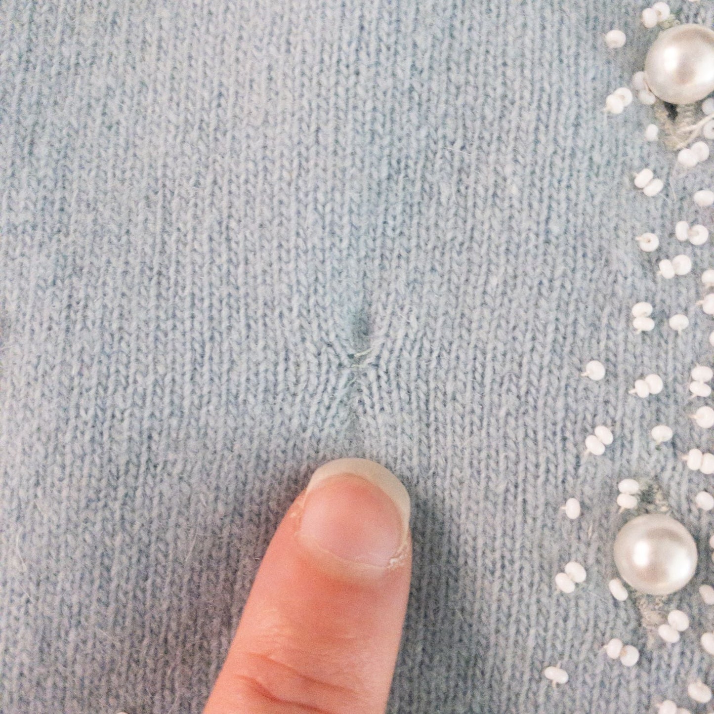 Stewarts pastel blue vintage cardigan with white bead floral embellishments and pearl buttons on a hanger image 6
