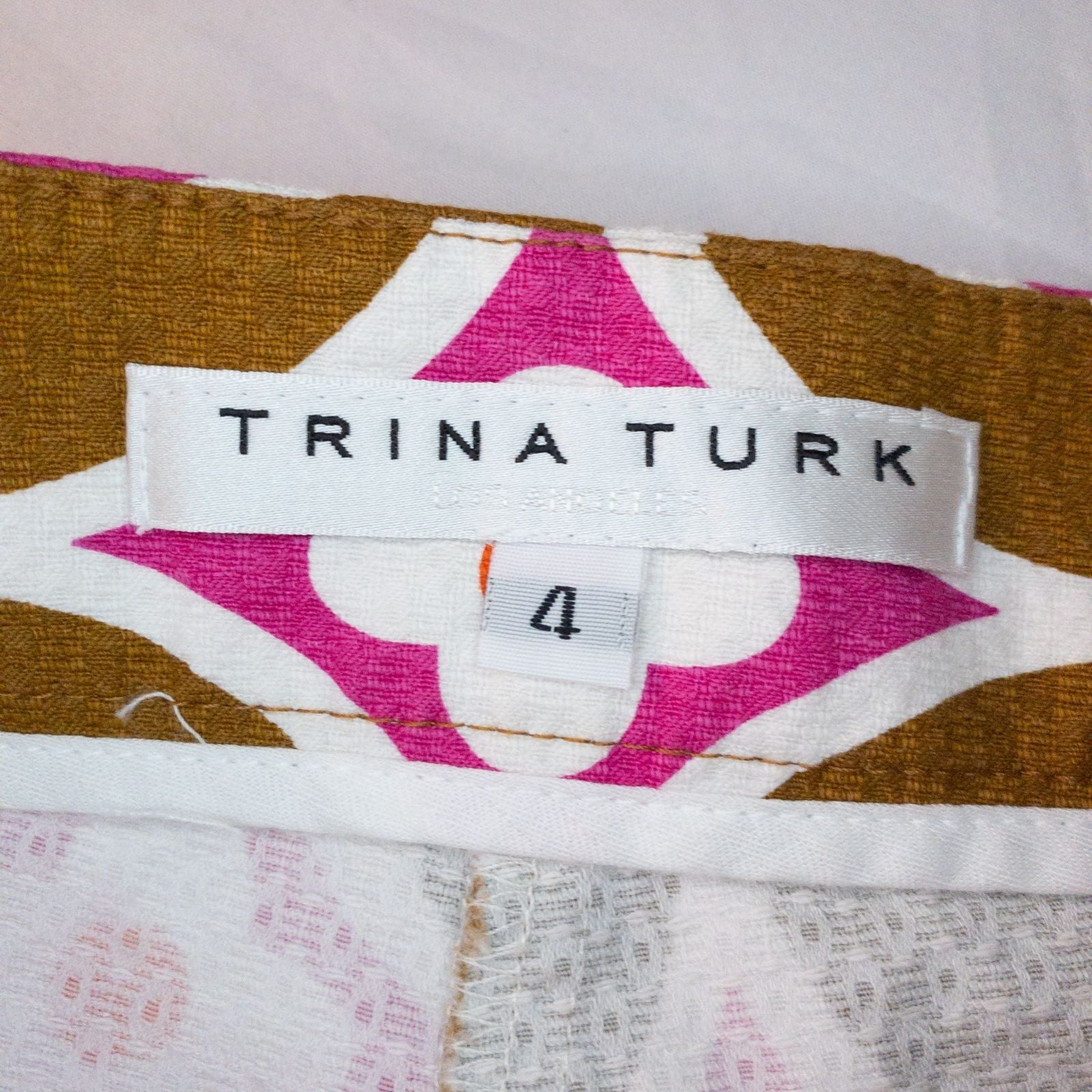 Trina Turk brown floral short shorts for women laid flat with visible tags and zipper hook closure image 4